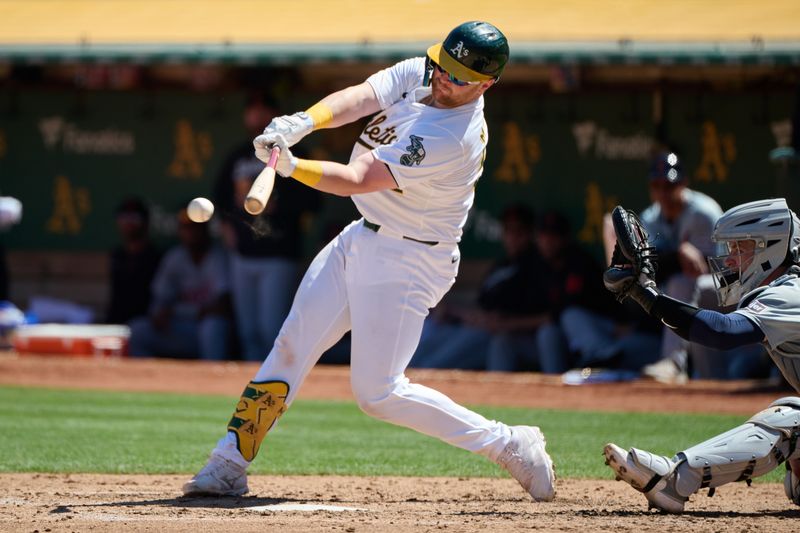 Sep 7, 2024; Oakland, California, USA; Oakland Athletics catcher Kyle McCann (52) hits an RBI single against the Detroit Tigers during the fifth inning at Oakland-Alameda County Coliseum. Mandatory Credit: Robert Edwards-Imagn Images