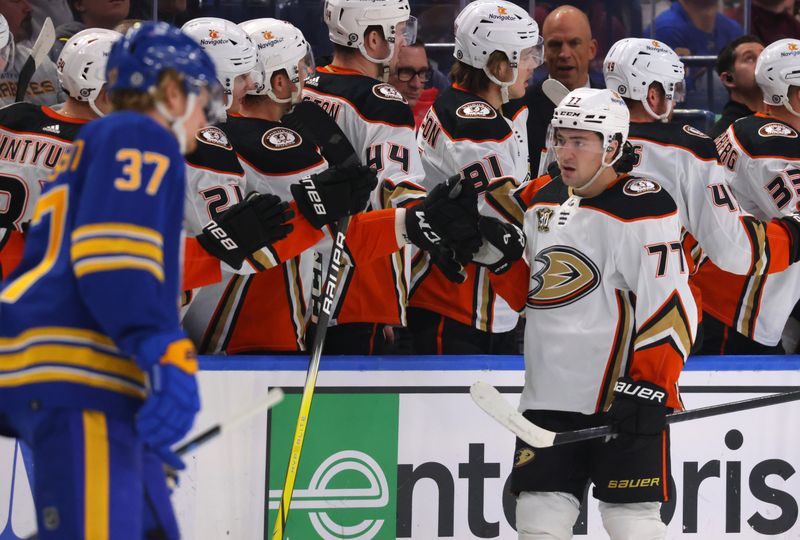 Feb 19, 2024; Buffalo, New York, USA;  Anaheim Ducks right wing Frank Vatrano (77) celebrates his goal with teammates during the second period against the Buffalo Sabres at KeyBank Center. Mandatory Credit: Timothy T. Ludwig-USA TODAY Sports