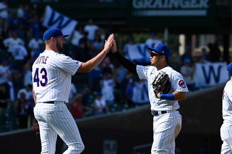 Sep 6, 2023; Chicago, Illinois, USA;  Chicago Cubs relief pitcher Luke Little (43) and Chicago Cubs right fielder Seiya Suzuki (27) high five after the game against the San Francisco Giants at Wrigley Field. Mandatory Credit: Matt Marton-USA TODAY Sports