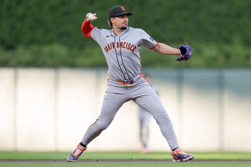 May 10, 2025; Minneapolis, Minnesota, USA; San Francisco Giants shortstop Willy Adames (2) throws to first to retire Minnesota Twins third base Royce Lewis (23) in the fourth inning at Target Field. Mandatory Credit: Matt Blewett-Imagn Images