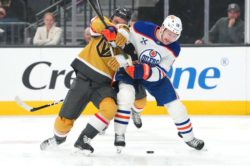 Mar 26, 2026; Las Vegas, Nevada, USA; Vegas Golden Knights defenseman Rasmus Andersson (4) attempts to hold Edmonton Oilers left wing Zach Hyman (18) during the first period at T-Mobile Arena. Mandatory Credit: Stephen R. Sylvanie-Imagn Images