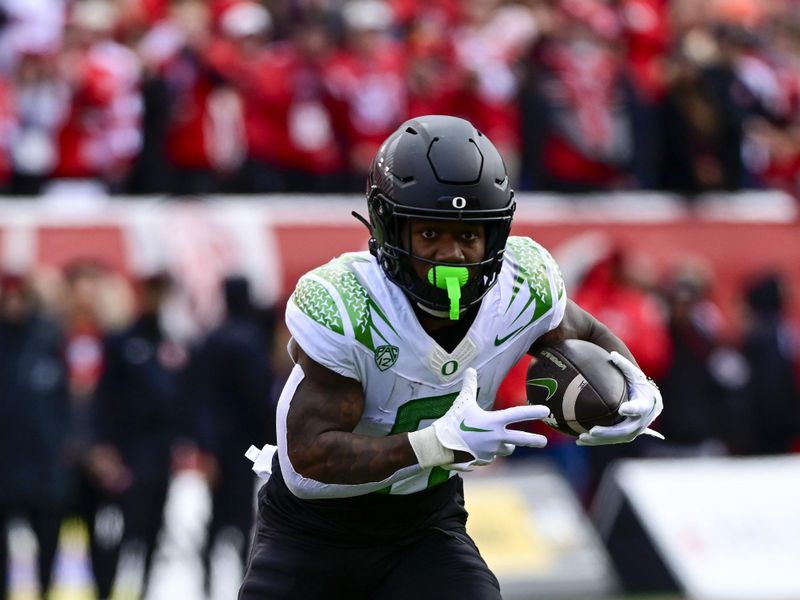 Oct 28, 2023; Salt Lake City, Utah, USA; Oregon Ducks running back Bucky Irving (0) runs the ball against the Utah Utes during the first half at Rice-Eccles Stadium. Mandatory Credit: Christopher Creveling-USA TODAY Sports