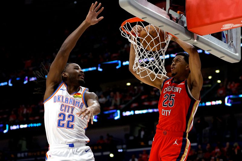 NEW ORLEANS, LOUISIANA - APRIL 27: Trey Murphy III #25 of the New Orleans Pelicans dunks the ball over Cason Wallace #22 of the Oklahoma City Thunder during the first quarter of Game Three of the first round of the 2024 NBA Playoffs at Smoothie King Center on April 27, 2024 in New Orleans, Louisiana. NOTE TO USER: User expressly acknowledges and agrees that, by downloading and or using this photograph, User is consenting to the terms and conditions of the Getty Images License Agreement. (Photo by Sean Gardner/Getty Images)