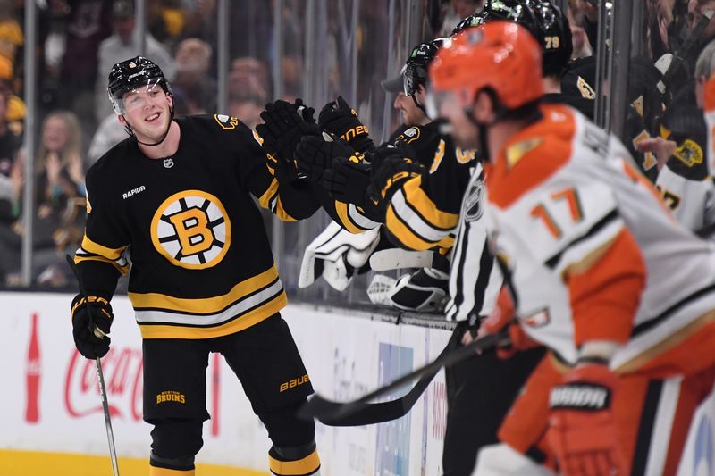 Oct 23, 2025; Boston, Massachusetts, USA; Boston Bruins defenseman Mason Lohrei (6) is congratulated by his teammates after scoring a goal during the second period against the Anaheim Ducks at TD Garden. Mandatory Credit: Bob DeChiara-Imagn Images