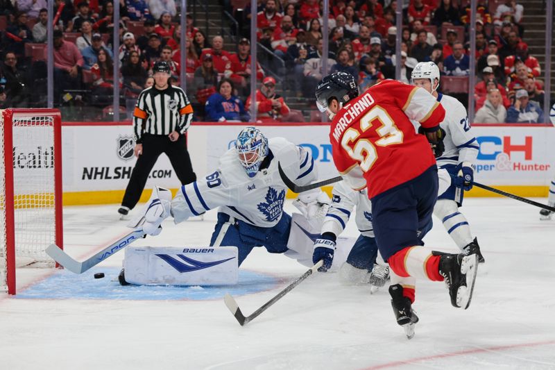 Feb 26, 2026; Sunrise, Florida, USA; Florida Panthers left wing Brad Marchand (63) scores against Toronto Maple Leafs goaltender Joseph Woll (60) during the first period at Amerant Bank Arena. Mandatory Credit: Sam Navarro-Imagn Images