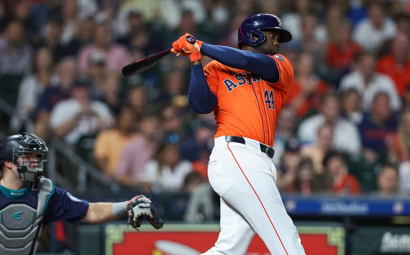 May 3, 2024; Houston, Texas, USA; Houston Astros designated hitter Yordan Alvarez (44) hits a double during the fourth inning against the Seattle Mariners at Minute Maid Park. Mandatory Credit: Troy Taormina-USA TODAY Sports