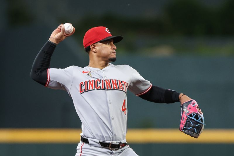 May 6, 2025; Cumberland, Georgia, USA; Cincinnati Reds second base Santiago Espinal (4) fields the ball for an out at first against the Atlanta Braves during the sixth inning at Truist Park. Mandatory Credit: Jordan Godfree-Imagn Images