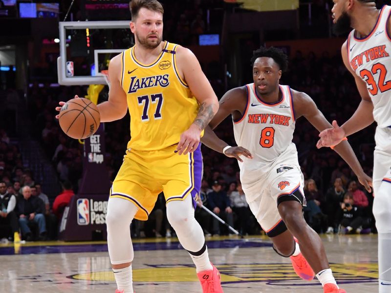 LOS ANGELES, CA - MARCH 6:  Luka Doncic #77 of the Los Angeles Lakers dribbles the ball during the game against the New York Knicks on March 6, 2025 at Crypto.Com Arena in Los Angeles, California. NOTE TO USER: User expressly acknowledges and agrees that, by downloading and/or using this Photograph, user is consenting to the terms and conditions of the Getty Images License Agreement. Mandatory Copyright Notice: Copyright 2025 NBAE (Photo by Juan Ocampo/NBAE via Getty Images)