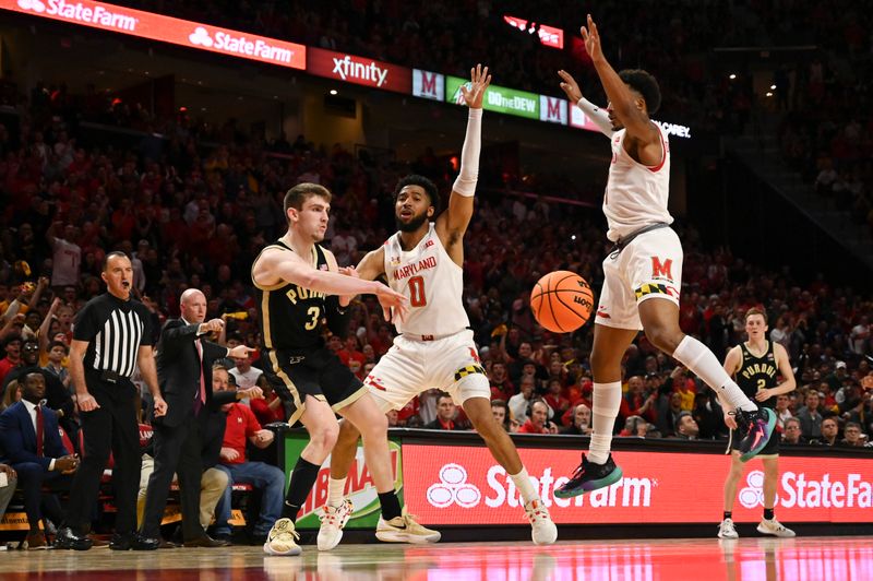 Feb 16, 2023; College Park, Maryland, USA; Purdue Boilermakers guard Braden Smith (3) attempts to pass around Maryland Terrapins guard Don Carey (0) and guard Jahmir Young (1) during the second half at Xfinity Center. Maryland Terrapins defeated Purdue Boilermakers 68-54. Mandatory Credit: Tommy Gilligan-USA TODAY Sports