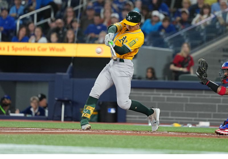 May 31, 2025; Toronto, Ontario, CAN; Athletics first baseman Tyler Soderstrom (21) hits a three run home run against the Toronto Blue Jays during the first inning at Rogers Centre. Mandatory Credit: Nick Turchiaro-Imagn Images
