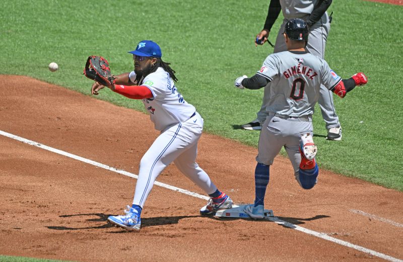 Jun 16, 2024; Toronto, Ontario, CAN;  Cleveland Guardians second baseman Andres Gimenez (0) beats the throw to Toronto Blue Jays first baseman Vladimir Guerrero Jr. (27) to avoid a double play in the first inning at Rogers Centre. Mandatory Credit: Dan Hamilton-USA TODAY Sports