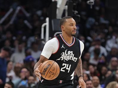 LOS ANGELES, CALIFORNIA - DECEMBER 06: Norman Powell #24 of the LA Clippers dribbles the ball against the Denver Nuggets during the second half a game at Crypto.com Arena on December 06, 2023 in Los Angeles, California. NOTE TO USER: User expressly acknowledges and agrees that, by downloading and or using this photograph, User is consenting to the terms and conditions of the Getty Images License Agreement.  (Photo by Michael Owens/Getty Images)