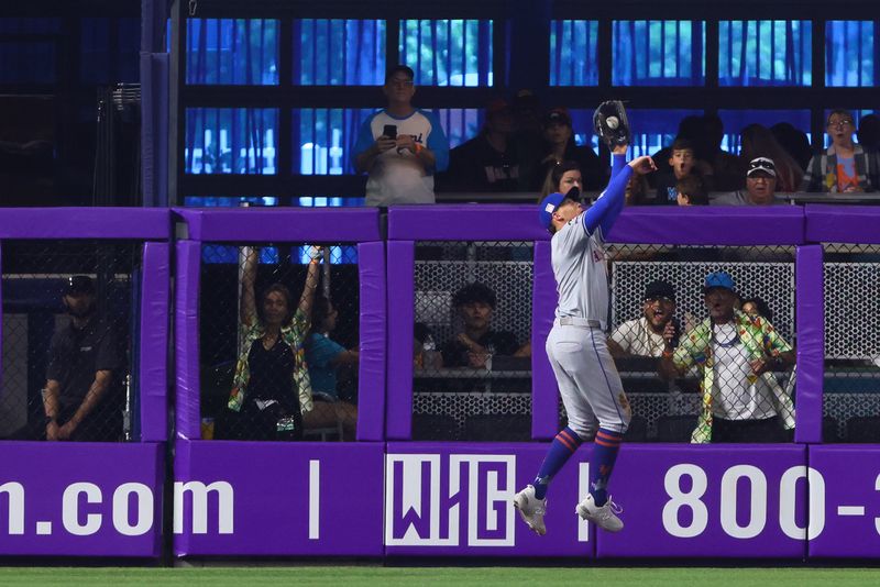 Jul 21, 2024; Miami, Florida, USA; New York Mets left fielder Brandon Nimmo (9) catches a fly ball to retire Miami Marlins right fielder Jesus Sanchez (12) during the second inning at loanDepot Park. Mandatory Credit: Sam Navarro-USA TODAY Sports