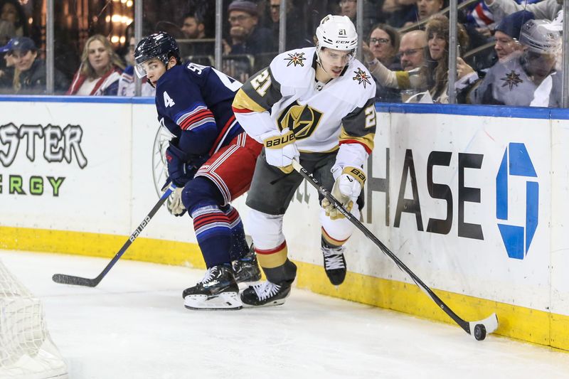 Jan 26, 2024; New York, New York, USA; Vegas Golden Knights center Brett Howden (21) skates past New York Rangers defenseman Braden Schneider (4) to control the puck in the third period at Madison Square Garden. Mandatory Credit: Wendell Cruz-USA TODAY Sports