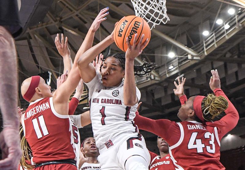 Mar 3, 2023; Greenville, SC, USA; South Carolina guard Zia Cooke (1) rebounds around Arkansas guard Rylee Langerman (11) and Arkansas guard Makayla Daniels (43) during the third quarter at Bon Secours Wellness Arena. Mandatory Credit: Ken Ruinard-USA TODAY Sports