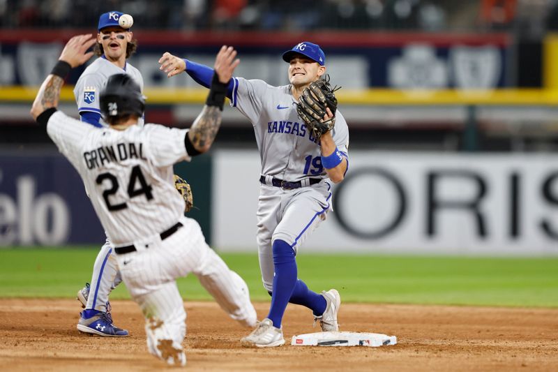 Sep 13, 2023; Chicago, Illinois, USA; Kansas City Royals second baseman Michael Massey (19) throws out Chicago White Sox catcher Yasmani Grandal (24) at second base during the fifth inning at Guaranteed Rate Field. Mandatory Credit: Kamil Krzaczynski-USA TODAY Sports