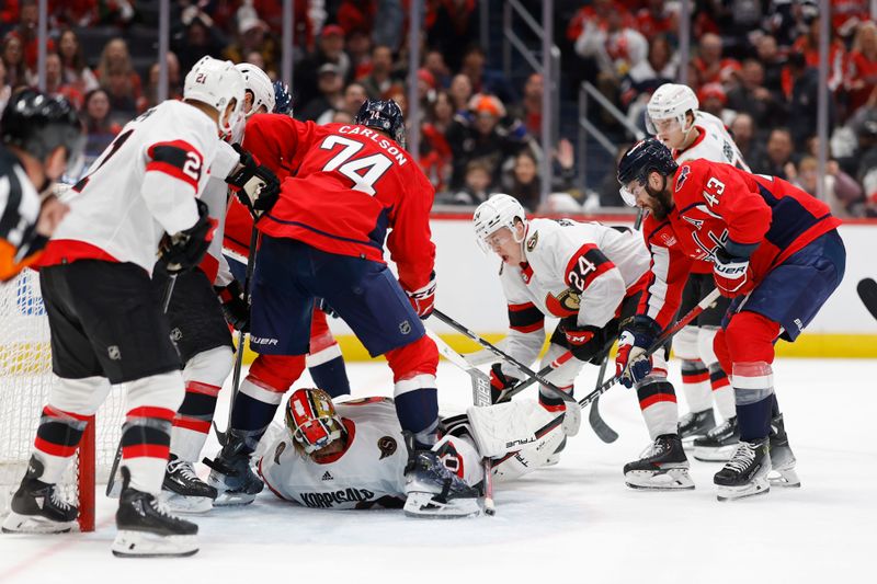 Apr 7, 2024; Washington, District of Columbia, USA; Ottawa Senators goaltender Joonas Korpisalo (70) covers the puck in front of Washington Capitals defenseman John Carlson (74) and Capitals right wing Tom Wilson (43) in the third period at Capital One Arena. Mandatory Credit: Geoff Burke-USA TODAY Sports