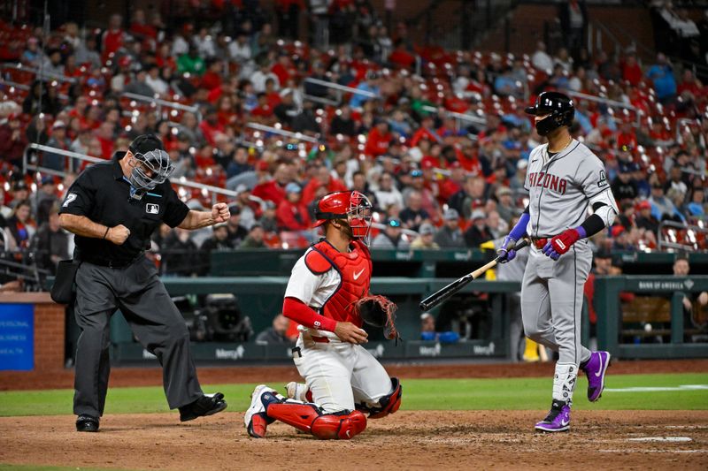 Apr 22, 2024; St. Louis, Missouri, USA;  Arizona Diamondbacks left fielder Lourdes Gurriel Jr. (12) is called out on strikes by umpire Brian O'Nora (7) during the ninth inning against the St. Louis Cardinals at Busch Stadium. Mandatory Credit: Jeff Curry-USA TODAY Sports