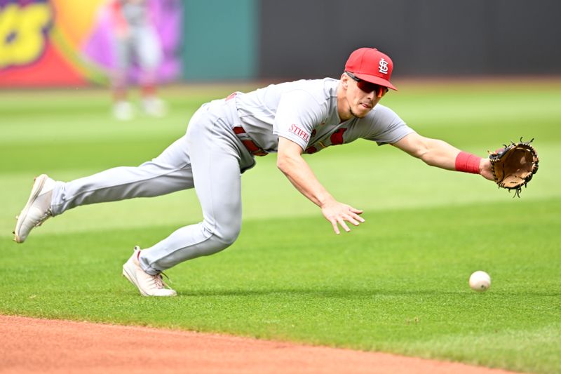 May 28, 2023; Cleveland, Ohio, USA; St. Louis Cardinals second baseman Tommy Edman (19) dives for a ball hit by Cleveland Guardians left fielder Steven Kwan (not pictured) during the first inning at Progressive Field. Kwan was safe with a single on the pay. Mandatory Credit: Ken Blaze-USA TODAY Sports