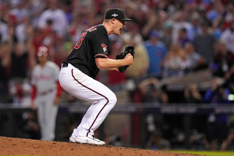 Oct 20, 2023; Phoenix, Arizona, USA; Arizona Diamondbacks relief pitcher Paul Sewald (38) celebrates after beating the Philadelphia Phillies in game four of the NLCS for the 2023 MLB playoffs at Chase Field. Mandatory Credit: Joe Camporeale-USA TODAY Sports