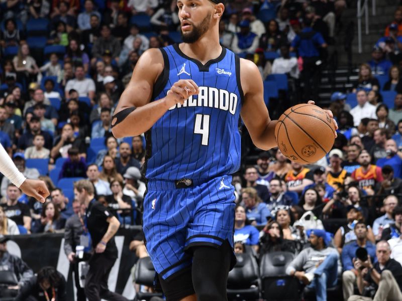 ORLANDO, FL - FEBRUARY 29: Jalen Suggs #4 of the Orlando Magic handles the ball during the game against the Utah Jazz on February 29, 2024 at Amway Center in Orlando, Florida. NOTE TO USER: User expressly acknowledges and agrees that, by downloading and or using this photograph, User is consenting to the terms and conditions of the Getty Images License Agreement. Mandatory Copyright Notice: Copyright 2024 NBAE (Photo by Fernando Medina/NBAE via Getty Images)