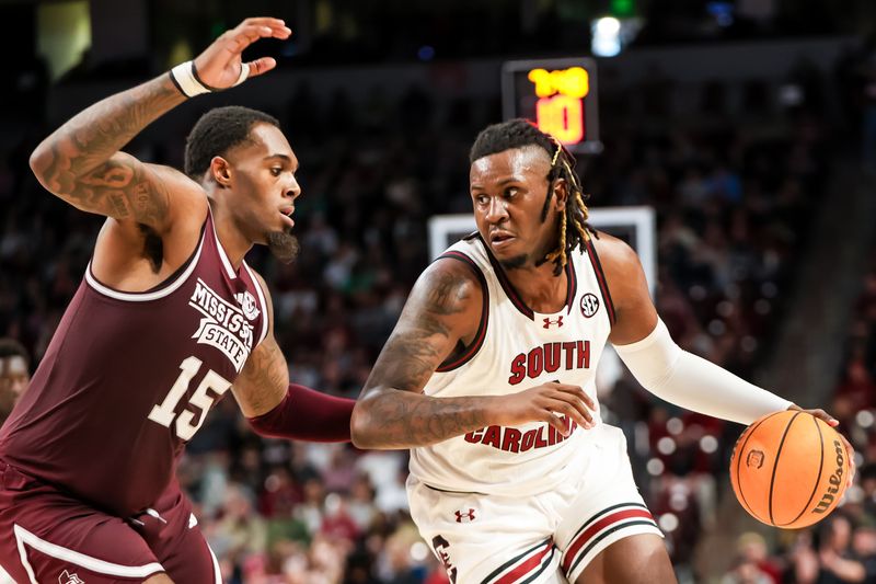 Jan 6, 2024; Columbia, South Carolina, USA; South Carolina Gamecocks forward B.J. Mack (2) drives around Mississippi State Bulldogs forward Jimmy Bell Jr. (15) in the first half at Colonial Life Arena. Mandatory Credit: Jeff Blake-USA TODAY Sports