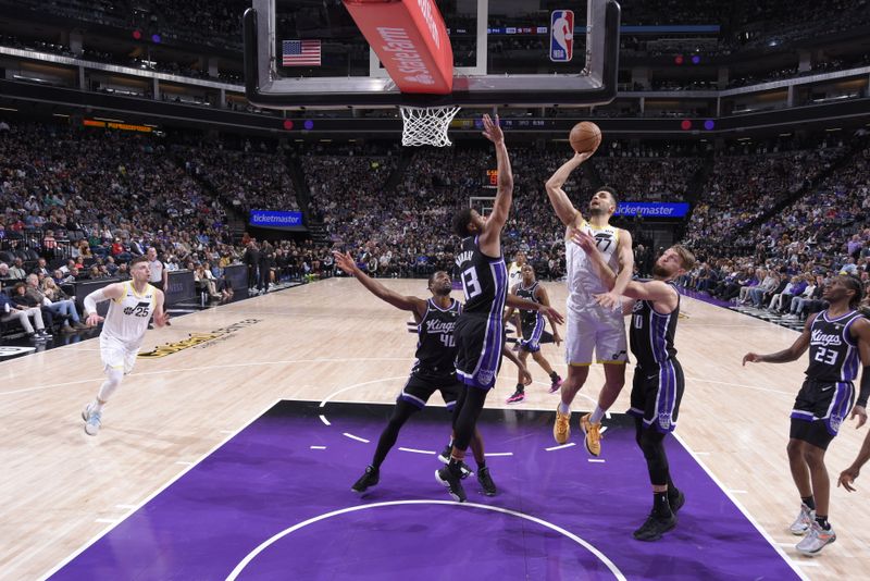 SACRAMENTO, CA - MARCH 31: Omer Yurtseven #77 of the Utah Jazz drives to the basket during the game against the Sacramento Kings on March 31, 2024 at Golden 1 Center in Sacramento, California. NOTE TO USER: User expressly acknowledges and agrees that, by downloading and or using this Photograph, user is consenting to the terms and conditions of the Getty Images License Agreement. Mandatory Copyright Notice: Copyright 2024 NBAE (Photo by Rocky Widner/NBAE via Getty Images)