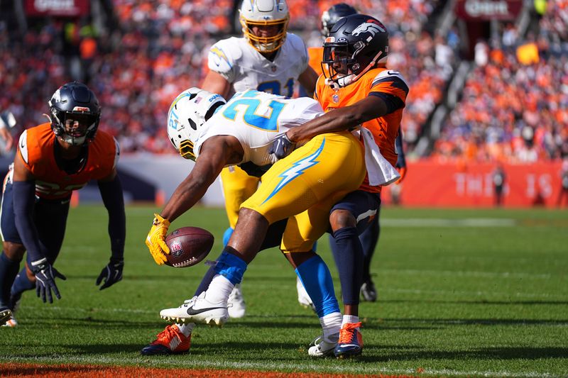 Los Angeles Chargers quarterback Easton Stick (2) runs for a touchdown in the 2nd quarter against the Denver Broncos of an NFL football game Sunday October 13, 2024, in Denver. (AP Photo/Bart Young)