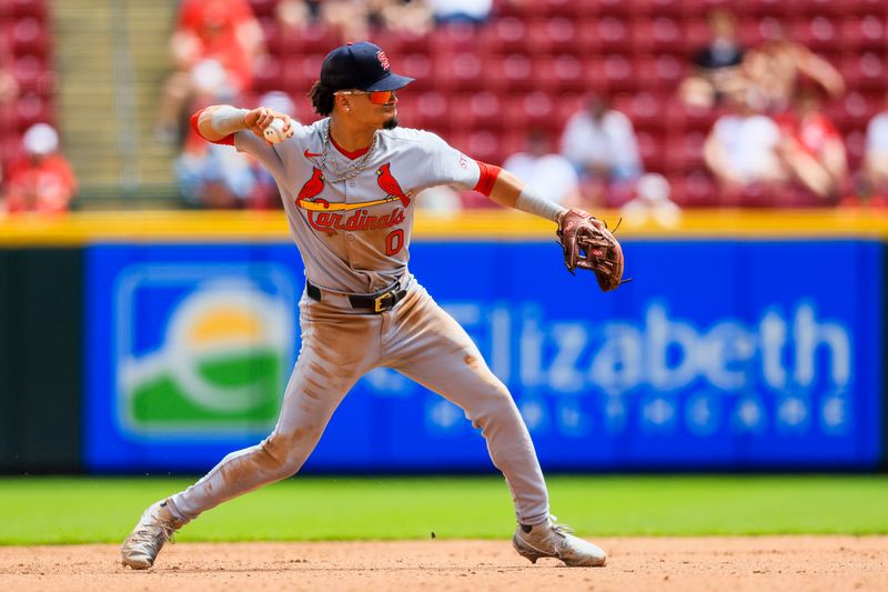 Apr 30, 2025; Cincinnati, Ohio, USA; St. Louis Cardinals shortstop Masyn Winn (0) throws to first to get Cincinnati Reds second baseman Matt McLain (not pictured) out in the eighth inning at Great American Ball Park. Mandatory Credit: Katie Stratman-Imagn Images
