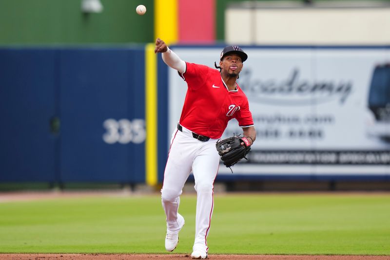 Mar 4, 2025; West Palm Beach, Florida, USA; Washington Nationals third base JosÈ Tena (8) throws the ball to first base for an out against the St. Louis Cardinals during the fourth inning at CACTI Park of the Palm Beaches. Mandatory Credit: Rich Storry-Imagn Images