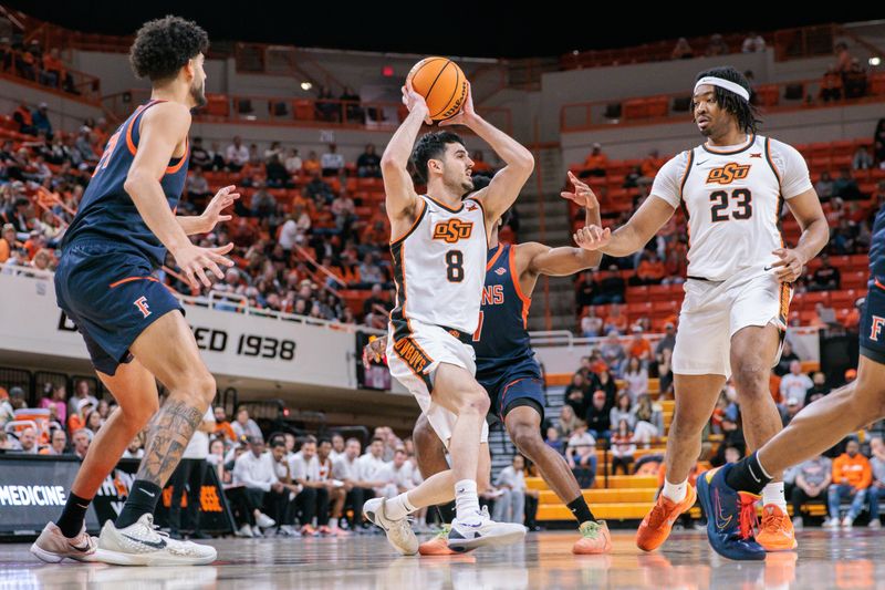 Dec 21, 2025; Stillwater, Oklahoma, USA; Oklahoma State Cowboys guard Daniel Guetta (8) looks to pass during the first half against the Cal State Fullerton Titans at Gallagher-Iba Arena. Mandatory Credit: William Purnell-Imagn Images