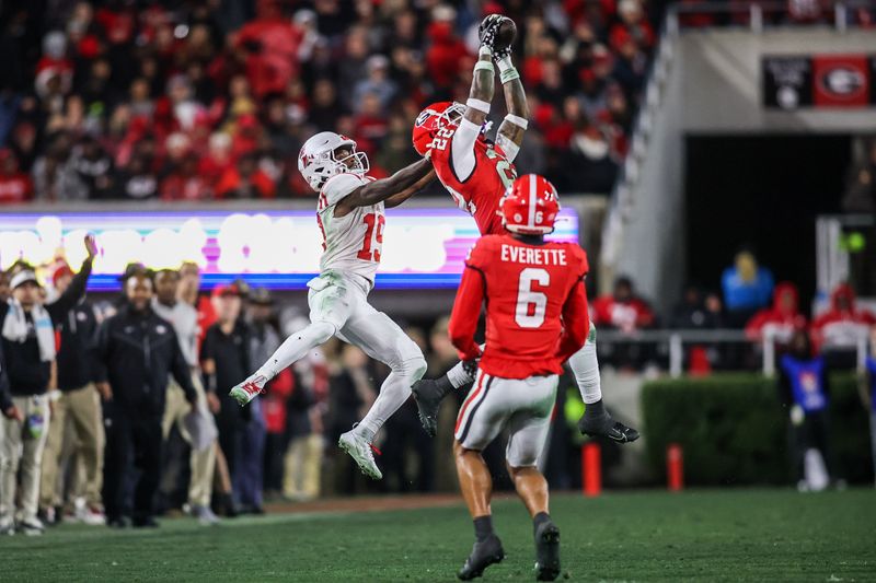 Nov 11, 2023; Athens, Georgia, USA; Georgia Bulldogs defensive back Javon Bullard (22) intercepts a pass intended for Mississippi Rebels wide receiver Dayton Wade (19) in the second quarter at Sanford Stadium. Mandatory Credit: Brett Davis-USA TODAY Sports