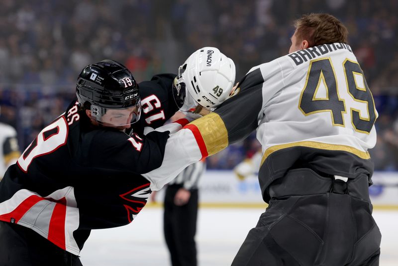 Mar 2, 2024; Buffalo, New York, USA;  Vegas Golden Knights center Ivan Barbashev (49) and Buffalo Sabres center Peyton Krebs (19) fight during the third period at KeyBank Center. Mandatory Credit: Timothy T. Ludwig-USA TODAY Sports