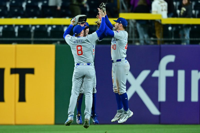 May 10, 2024; Pittsburgh, Pennsylvania, USA; Chicago Cubs left fielder Ian Happ (8) center fielder Pete Crow-Armstrong (52) and right fielder Mike Tauchman (40) celebrate after the Cubs defeated the Pittsburgh Pirates at PNC Park. Mandatory Credit: David Dermer-USA TODAY Sports