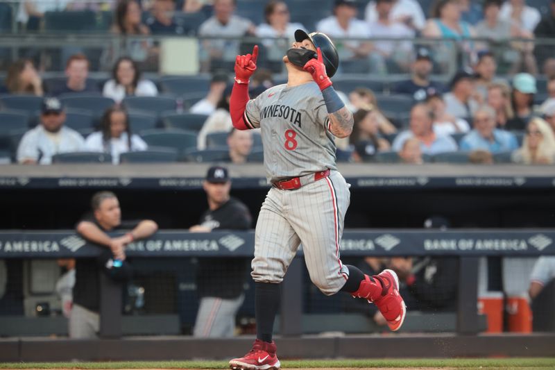 Jun 6, 2024; Bronx, New York, USA;  Minnesota Twins catcher Christian Vazquez (8) celebrates his solo home run during the third inning against the New York Yankees at Yankee Stadium. Mandatory Credit: Vincent Carchietta-USA TODAY Sports