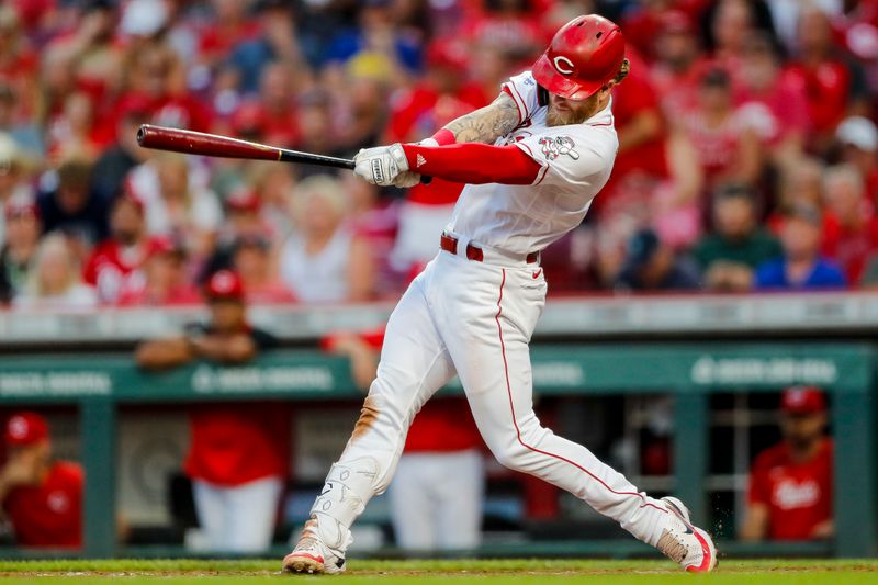 Sep 5, 2023; Cincinnati, Ohio, USA; Cincinnati Reds designated hitter Jake Fraley (27) hits a RBI double against in the third inning against the Seattle Mariners at Great American Ball Park. Mandatory Credit: Katie Stratman-USA TODAY Sports