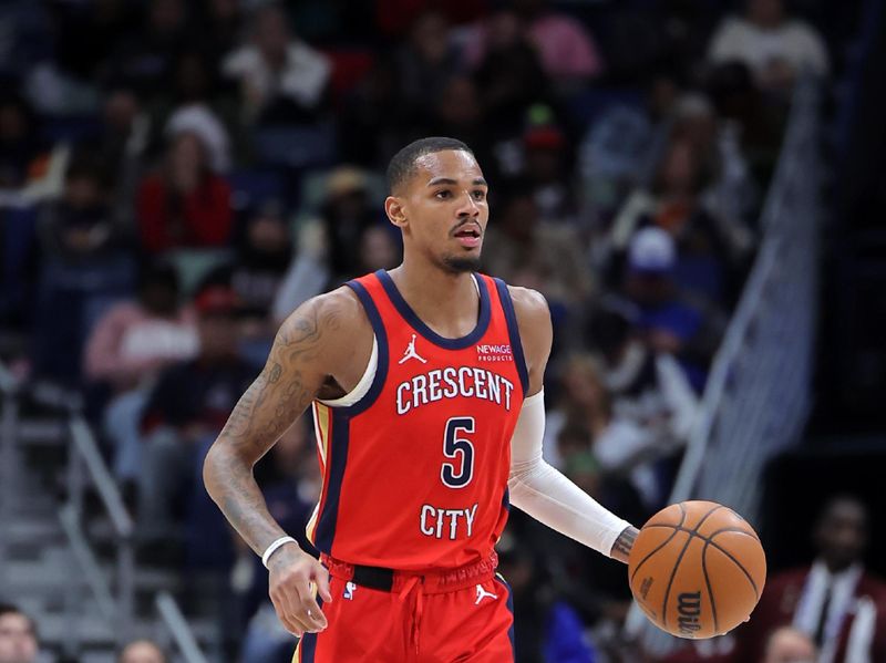 NEW ORLEANS, LOUISIANA - DECEMBER 12: Dejounte Murray #5 of the New Orleans Pelicans drives with the ball against the Sacramento Kings during a game at the Smoothie King Center on December 12, 2024 in New Orleans, Louisiana. NOTE TO USER: User expressly acknowledges and agrees that, by downloading and or using this Photograph, user is consenting to the terms and conditions of the Getty Images License Agreement. (Photo by Jonathan Bachman/Getty Images)