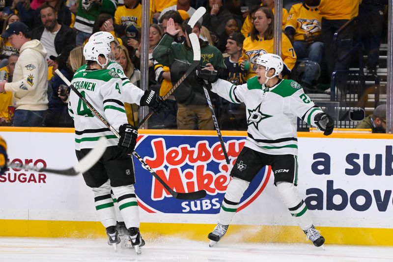 Oct 10, 2024; Nashville, Tennessee, USA;  Dallas Stars left wing Jason Robertson (21) celebrates his goal with his teammates against the Nashville Predators during the second period at Bridgestone Arena. Mandatory Credit: Steve Roberts-Imagn Images