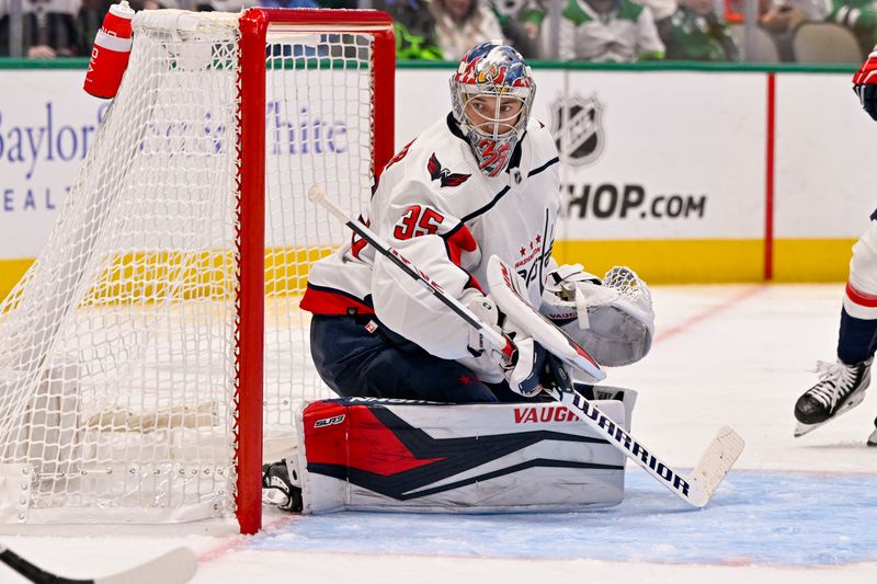 Oct 27, 2022; Dallas, Texas, USA; Washington Capitals goaltender Darcy Kuemper (35) defends against the Dallas Stars attack during the second period at the American Airlines Center. Mandatory Credit: Jerome Miron-USA TODAY Sports