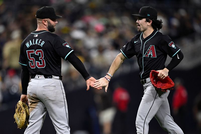 Jul 6, 2024; San Diego, California, USA; Arizona Diamondbacks first baseman Christian Walker (53) and right fielder Corbin Carroll (7) celebrate on the field after defeating the San Diego Padres at Petco Park. Mandatory Credit: Orlando Ramirez-USA TODAY Sports