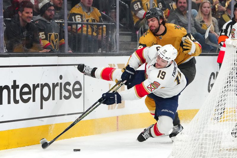 Jan 4, 2024; Las Vegas, Nevada, USA; Vegas Golden Knights defenseman Nicolas Hague (14) checks Florida Panthers left wing Matthew Tkachuk (19) during the first period at T-Mobile Arena. Mandatory Credit: Stephen R. Sylvanie-USA TODAY Sports