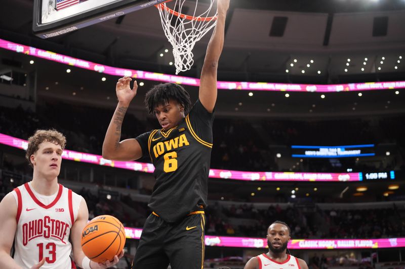 Mar 12, 2026; Chicago, IL, USA; Iowa Hawkeyes guard Tavion Banks (6) dunks the ball on Ohio State Buckeyes center Christoph Tilly (13) during the second half at United Center. Mandatory Credit: David Banks-Imagn Images