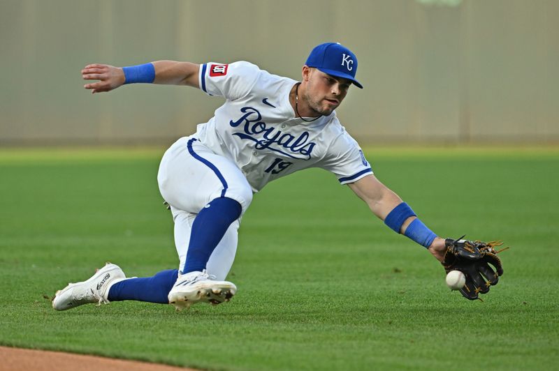 May 21, 2024; Kansas City, Missouri, USA;  Kansas City Royals second baseman Michael Massey (19) reaches out for a ground ball in the fourth inning against the Detroit Tigers at Kauffman Stadium. Mandatory Credit: Peter Aiken-USA TODAY Sports