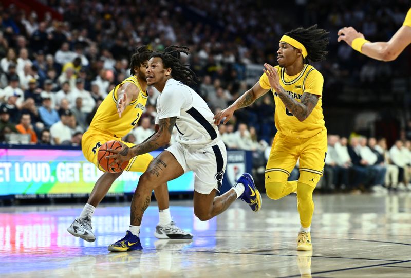 Jan 7, 2024; Philadelphia, Pennsylvania, USA; Penn State Nittany Lions guard Ace Baldwin Jr (1) drives past Michigan Wolverines guard Dug McDaniel (0) and forward Tray Jackson (2) in the first half at The Palestra. Mandatory Credit: Kyle Ross-USA TODAY Sports