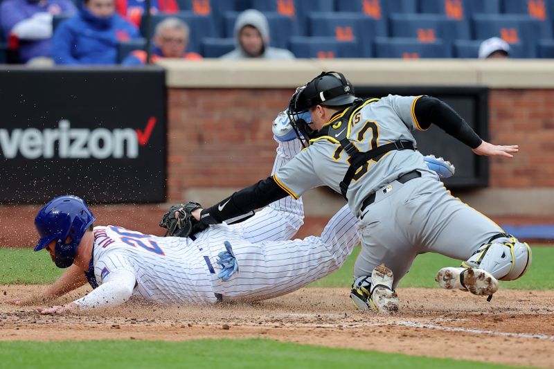 Apr 17, 2024; New York City, New York, USA; New York Mets first baseman Pete Alonso (20) scores on a fielder's choice hit into by catcher Francisco Alvarez (not pictured) ahead of the tag by Pittsburgh Pirates catcher Henry Davis (32) during the eighth inning at Citi Field. Mandatory Credit: Brad Penner-USA TODAY Sports