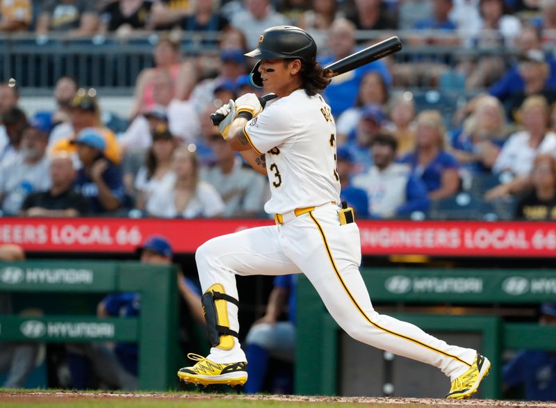 Aug 26, 2024; Pittsburgh, Pennsylvania, USA;  Pittsburgh Pirates center fielder Ji Hwan Bae (3) drives in a run on a fields choice against the Chicago Cubs during the third inning at PNC Park. Mandatory Credit: Charles LeClaire-USA TODAY Sports