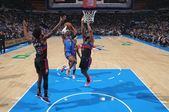 OKLAHOMA CITY, OK - OCTOBER 30:  Shai Gilgeous-Alexander #2 of the Oklahoma City Thunder drives to the basket during the game against the Detroit Pistons on October 30, 2023 at Paycom Arena in Oklahoma City, Oklahoma. NOTE TO USER: User expressly acknowledges and agrees that, by downloading and or using this photograph, User is consenting to the terms and conditions of the Getty Images License Agreement. Mandatory Copyright Notice: Copyright 2023 NBAE (Photo by Zach Beeker/NBAE via Getty Images)