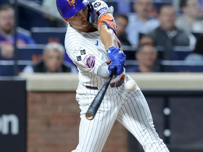 Sep 18, 2024; New York City, New York, USA; New York Mets right fielder Tyrone Taylor (15) hits an RBI double against the Washington Nationals during the fourth inning at Citi Field. Mandatory Credit: Brad Penner-Imagn Images