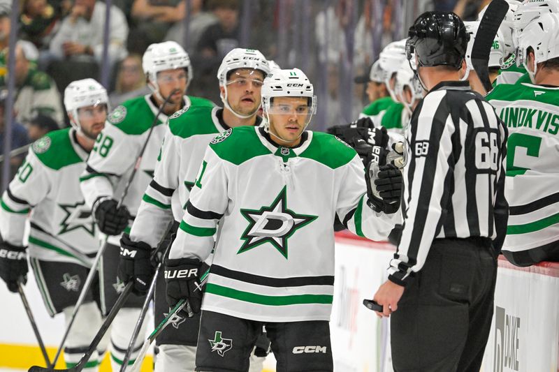 Sep 29, 2024; Saint Paul, Minnesota, USA;  Dallas Stars forward Logan Stankoven (11) celebrates his goal against the Minnesota Wild during the second period at Xcel Energy Center. Mandatory Credit: Nick Wosika-Imagn Images