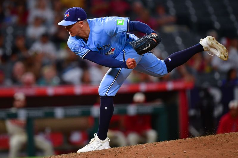 Aug 12, 2024; Anaheim, California, USA; Toronto Blue Jays pitcher Chad Green (57) throws against the Los Angeles Angels during the ninth inning at Angel Stadium. Mandatory Credit: Gary A. Vasquez-USA TODAY Sports